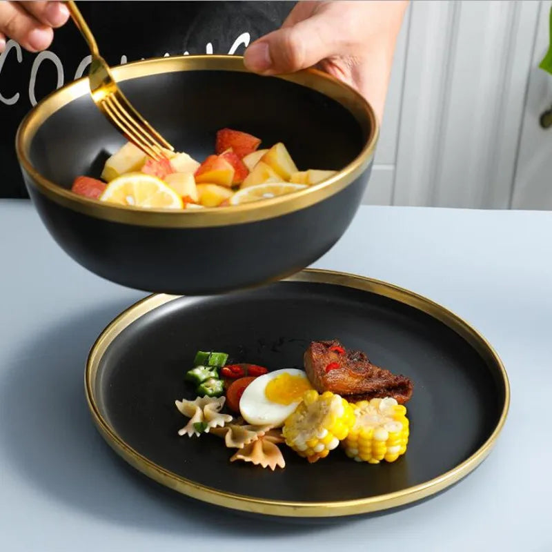 Set of matte gold inlay black porcelain dinnerware from MC THE BLACK DIAMOND, including plates and bowls for kitchen use