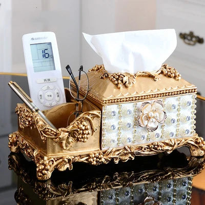 Decorative resin diamond fruit plate by MC THE BLACK DIAMOND, featuring dried fruit, candies, tissue box ornaments on a home living room table