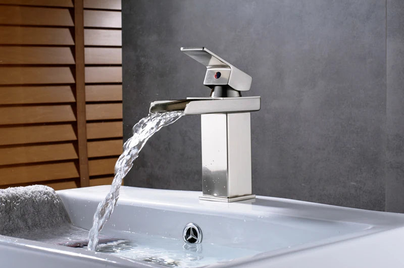 Black Waterfall Bathroom Vanity Faucet mounted on a basin vessel sink, stylish black bath fixture from MC THE BLACK DIAMOND