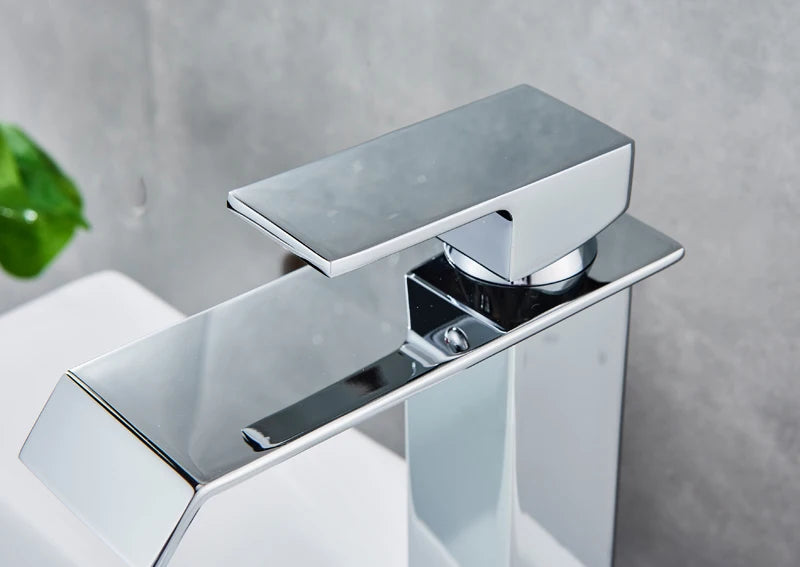 Black waterfall bathroom faucet by MC The Black Diamond with basin vessel sink, modern bath fixture, sleek black water feature