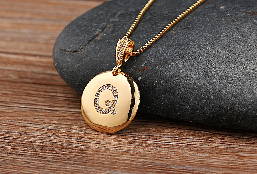 Copper initial letter necklace featuring A-Z charms from 𝕄𝕔 𝕋𝕙𝕖 𝔹𝕝𝕒𝕔𝕜 𝔻𝕚𝕒𝕞𝕠�