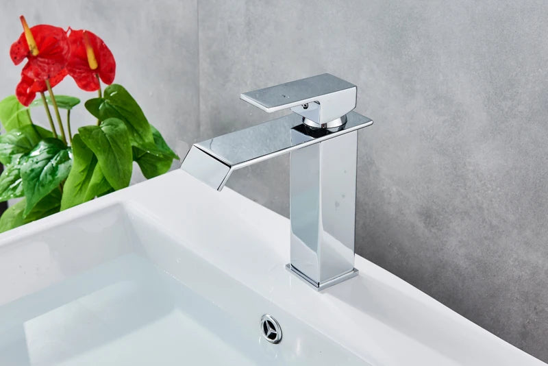 Black Waterfall Bathroom Faucet mounted on a basin vanity vessel sink by MC THE BLACK DIAMOND, showcasing sleek modern bathroom decor.
