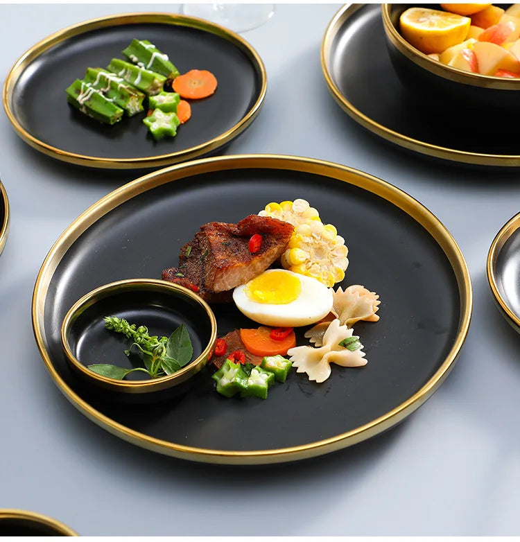 Set of matte gold inlay black porcelain dinnerware from MC THE BLACK DIAMOND, includes plates and bowls for elegant kitchen use
