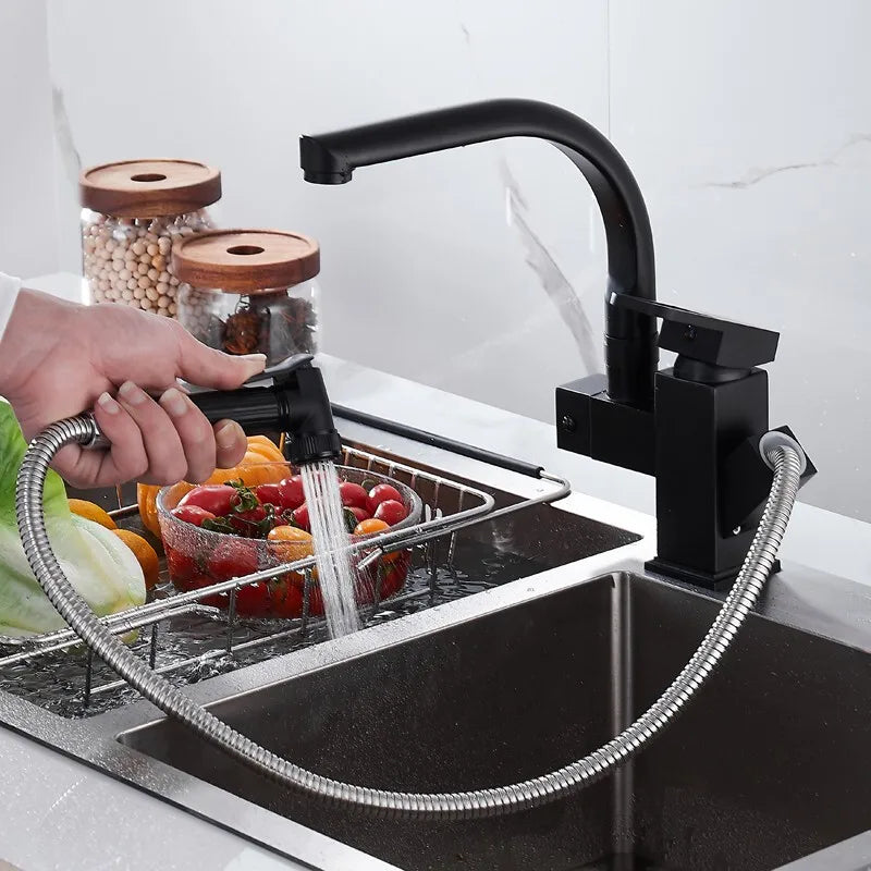 Black deck-mounted kitchen sink faucet with flexible pull-out sprayer, spring spout, hot and cold water, chrome silver finish.