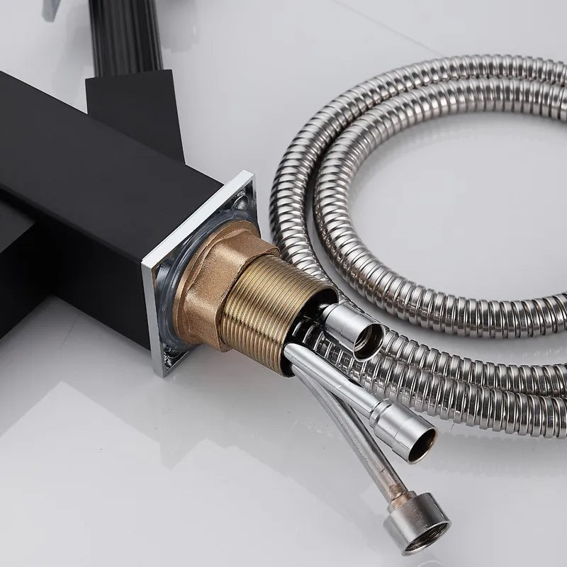 Black deck-mounted kitchen sink faucet by MC THE BLACK DIAMOND featuring a flexible pull-out spray and spring spout.