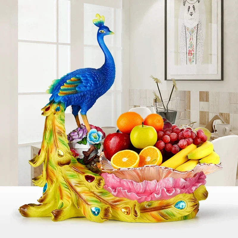 Decorative European style peacock fruit candy plate by MC THE BLACK DIAMOND, with colorful dry fruit and dim sum on a stylish home desktop tray.
