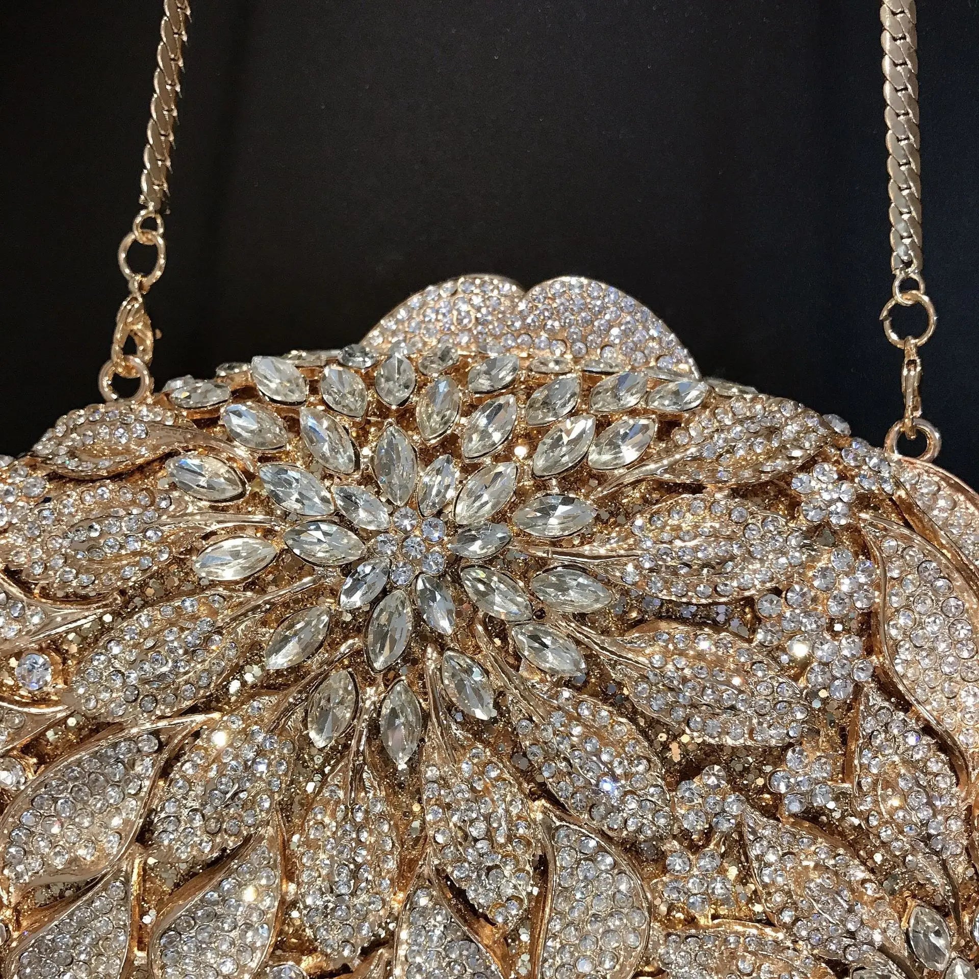 Gold metal leaves and white crystal evening clutch bag by MC THE BLACK DIAMOND, featuring a mini heart shape with rhinestones for women’s parties.