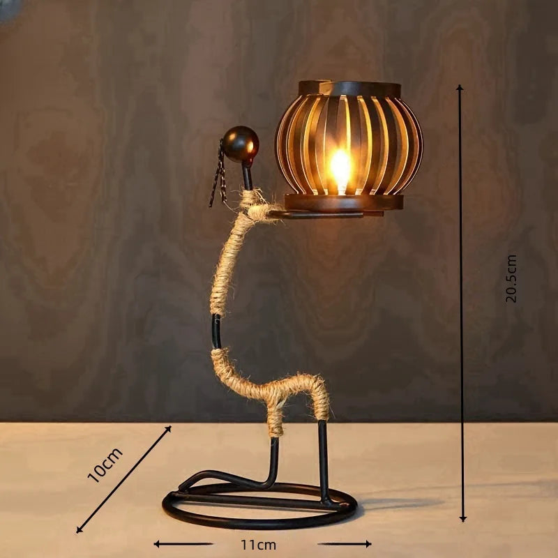 Nordic metal candle holder featuring an abstract character sculpture by ๐๐ ๐๐๐ ๐น๐๐๐๐ ๐ป๐๐๐๐