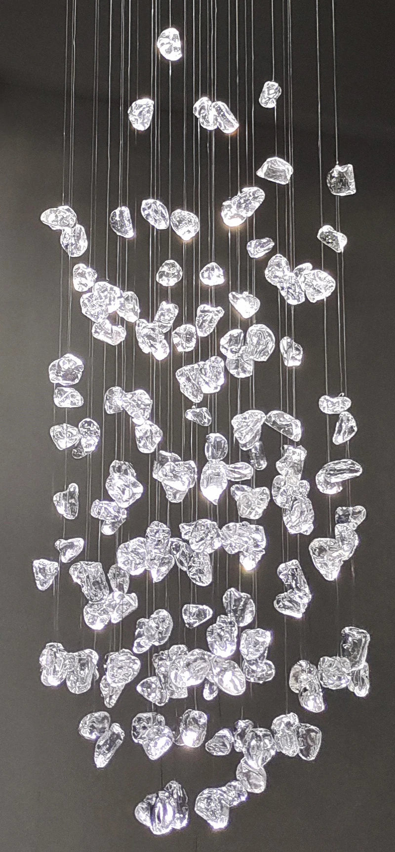 Black Art Luxury Stone Crystal Chandelier by MC THE BLACK DIAMOND hanging in a modern staircase hallway with LED lights.