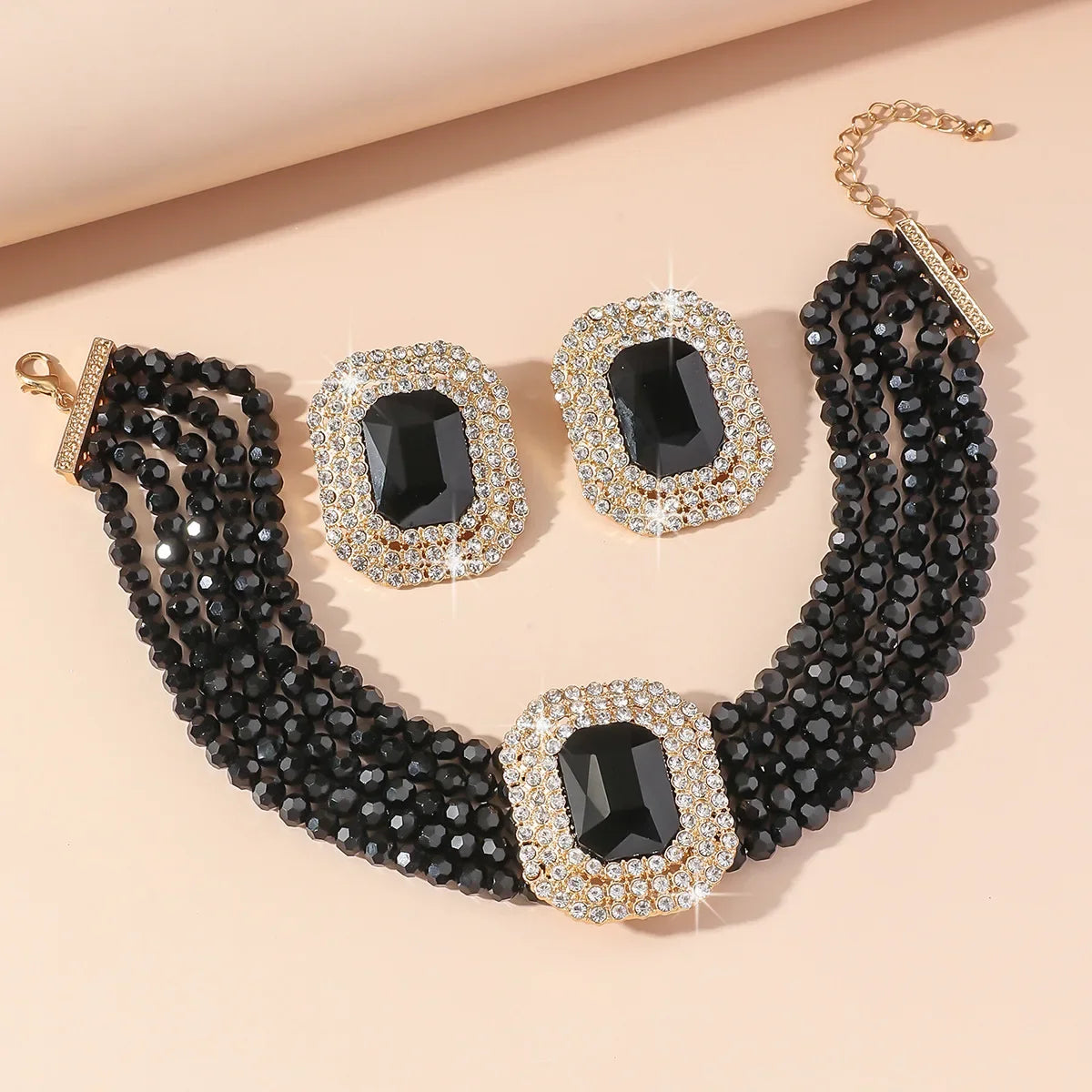FYUAN jewelry set featuring multilevel champagne, red, white, black crystal geometric square earrings and necklace by MC THE BLACK DIAMOND