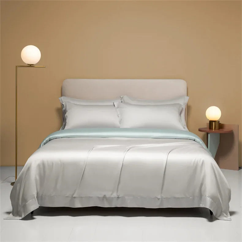 Luxury Mulberry Silk duvet cover in solid color, displayed on a bed with high-quality bedsheets by šš ššš š¹šššš š»š