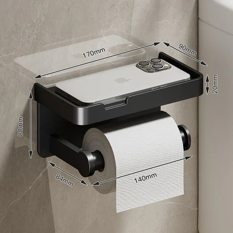 Black gold toilet paper holder from MC THE BLACK DIAMOND, mounted on bathroom wall with sleek modern design.