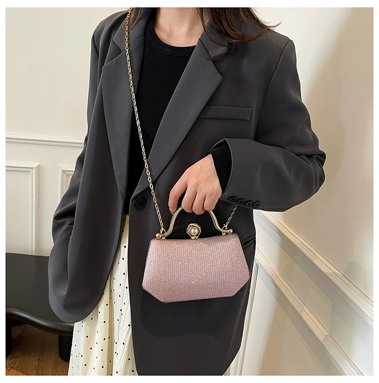 Black MC The Diamonds hand bag with a solid color, chain strap, simple crossbody design, and high-quality craftsmanship.