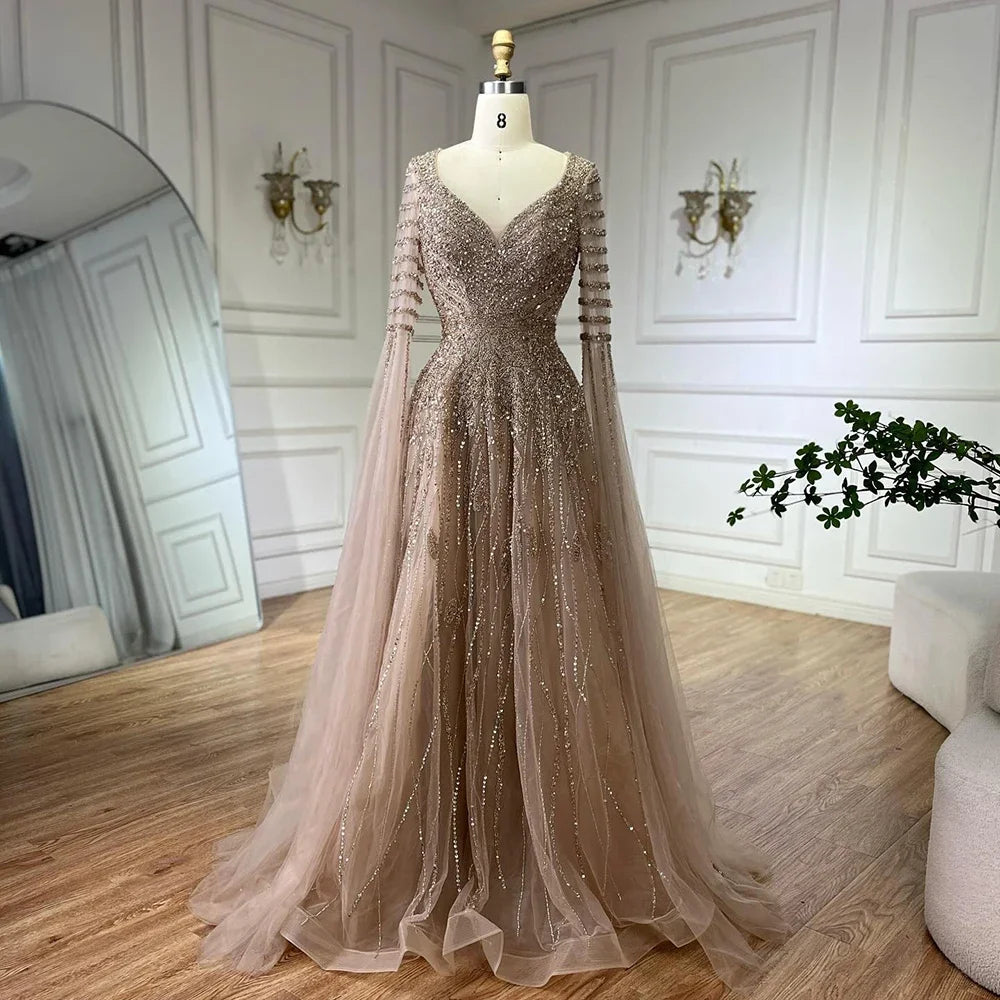 Elegant Arabic caramel beaded A-line evening dress by MC THE BLACK DIAMOND featuring intricate beadwork and flowing fabric.