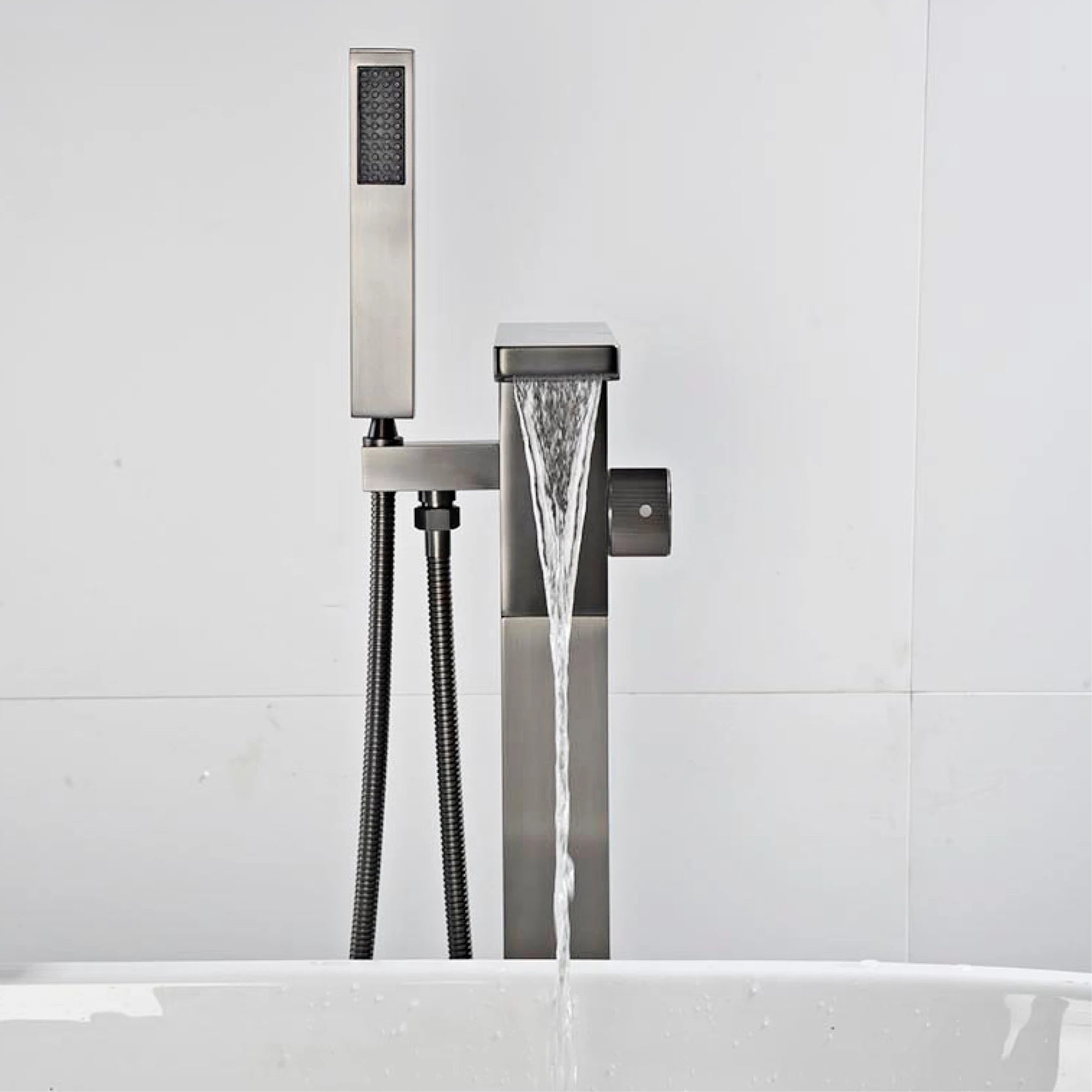 Luxury black brass floor standing bathroom faucet with single handle for hot and cold water, embedded design for bathtub use.