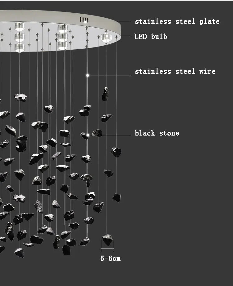Modern black art luxury stone crystal chandelier by MC THE BLACK DIAMOND hanging in a staircase hallway with LED lighting.