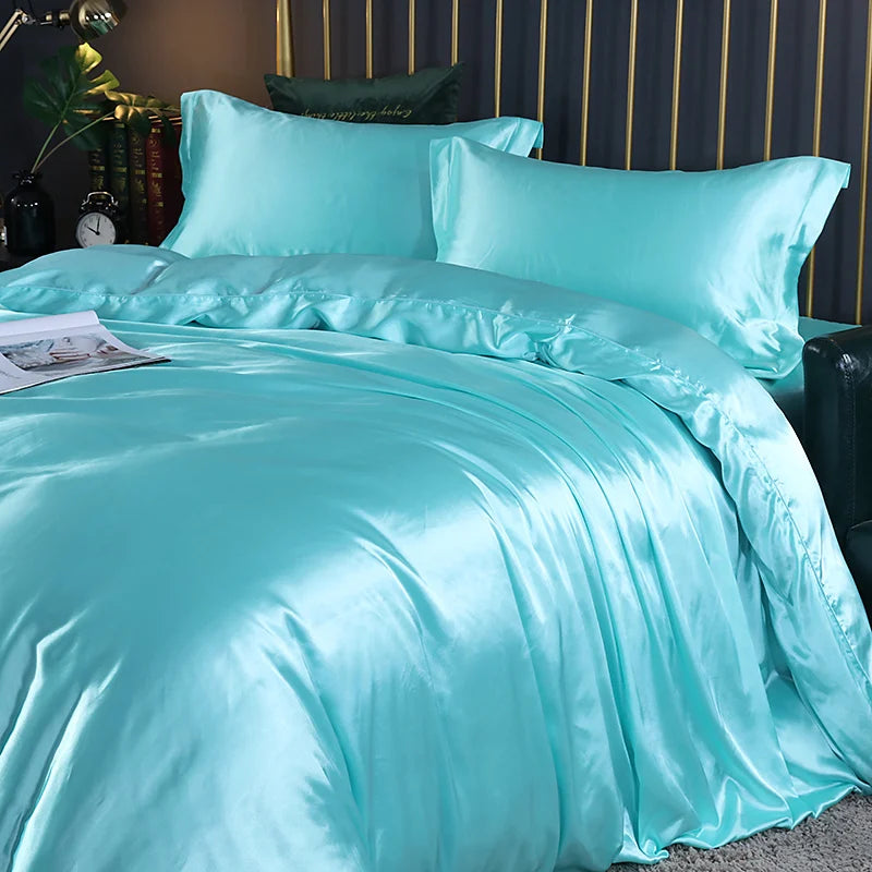 Luxury silk bedding set with duvet cover, fitted sheet, flat sheet, and pillowcases in solid colors, king and queen sizes.