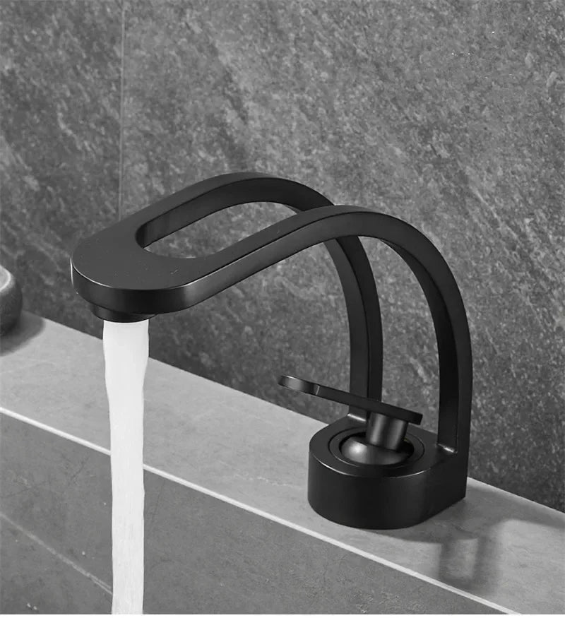 Black and gold MC THE BLACK DIAMOND bathroom mixer tap for wash basin, sleek black grey and white finish with modern bath design.