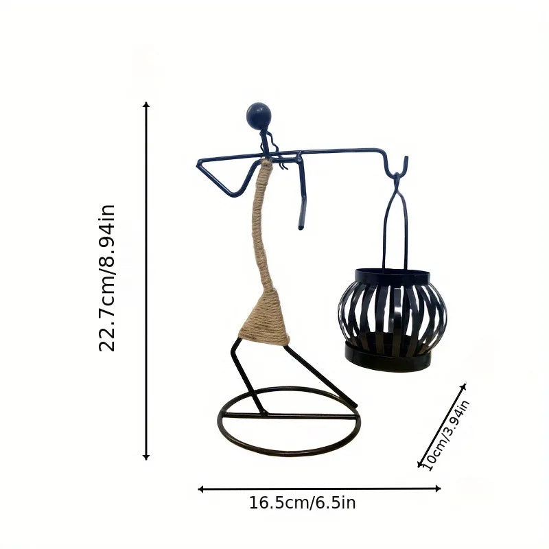 Nordic metal candlestick sculpture by MC The Black Diamond, featuring an abstract character design, handmade candle holder for home decor.