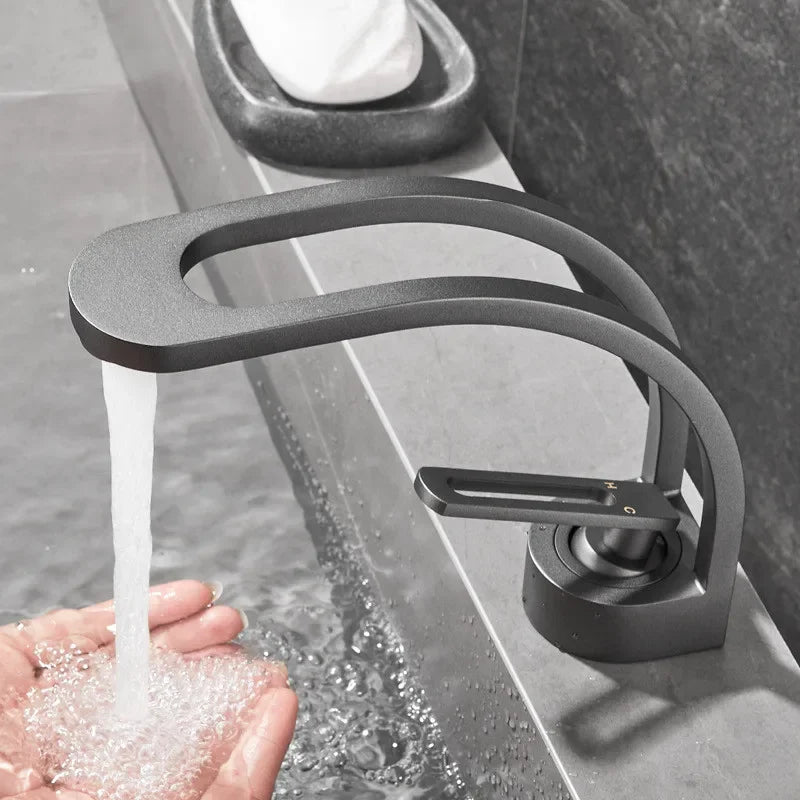 Black, grey, white, and gold MC THE BLACK DIAMOND bathroom mixer tap for wash basin, stylish bath fixture with modern design.