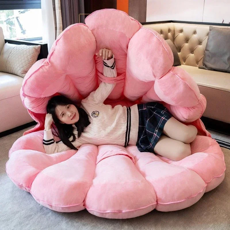 Large clamshell-shaped plush cushion by MC The Black Diamond, featuring a giant seashell design for kid's sofa or bed decor.