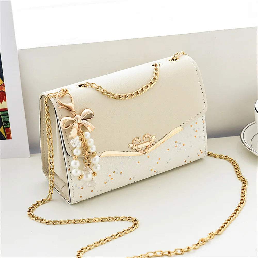 Black leather fashion messenger bag for women with sequins, tassel pendant, and mobile phone pouch, from ๐๐ ๐๐๐ ๐น๐๐๐๐ ๐ป๏ฟฝ
