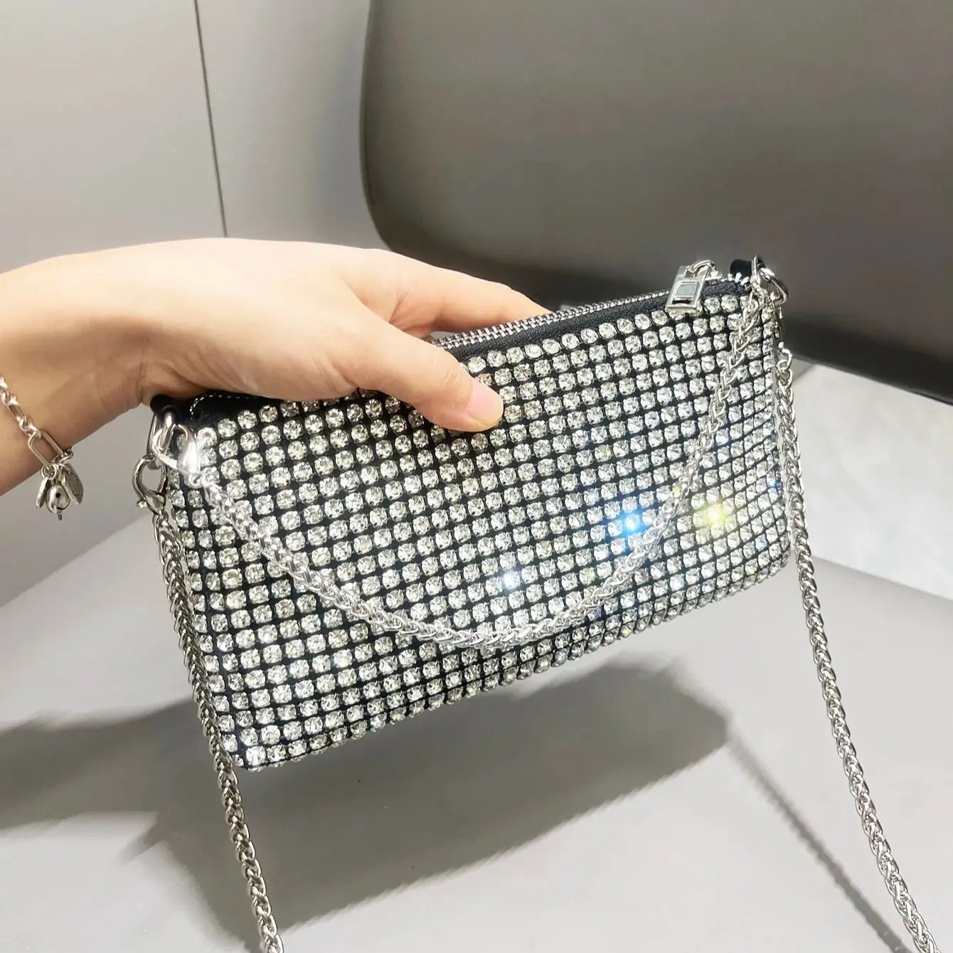 Luxury MC THE BLACK DIAMOND rhinestones clutch purse with handle, elegant women's shoulder bag with sparkling embellishments.