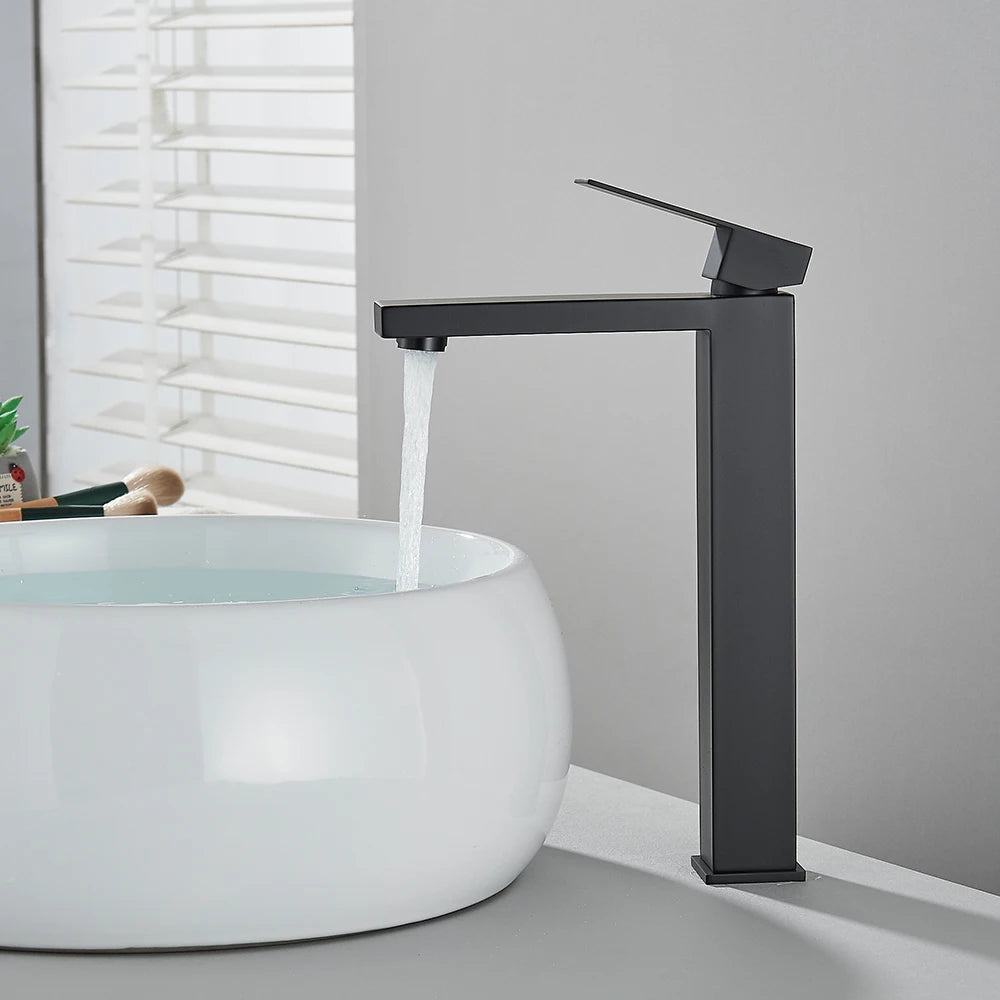 Matte black stainless steel bathroom sink faucet with cold and hot water handles, deck-mounted waterfall design by ๐๐ฎ ๐๐๐ ๐น๐๐๐๐ ๐ป๐