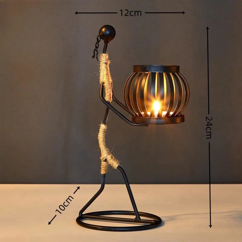 Nordic metal candle holder with abstract character sculpture, handmade figurine decor by ๐๐ ๐๐๐ ๐น๐๐๐๐ ๐ป๐๐๏ฟฝ