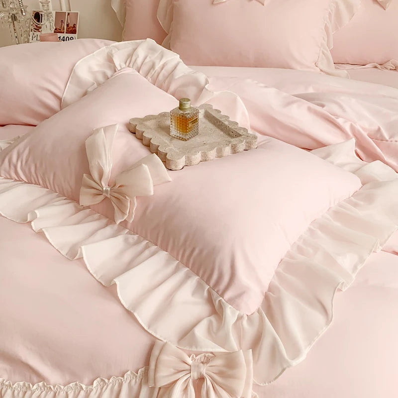 Three-piece white bedding set with ruffled duvet cover from MC The Black Diamonds, showcasing soft bedsheets and elegant design.