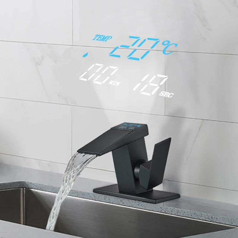 Digital display basin sink faucet by MC The Black Diamonds with LED temperature indicator, waterfall spout, hot and cold water controls.