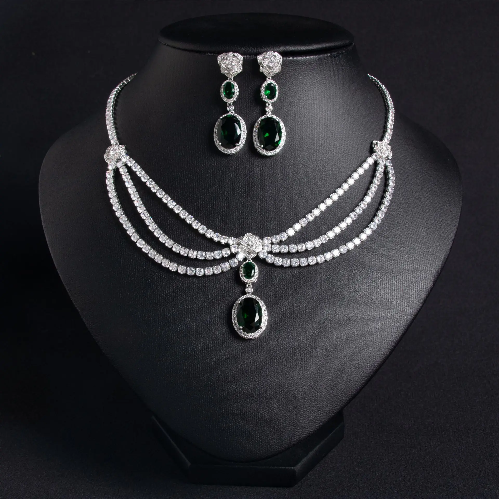 Elegant women's jewelry set with green zircon flower necklace and matching tassel earrings, stylish and sophisticated.