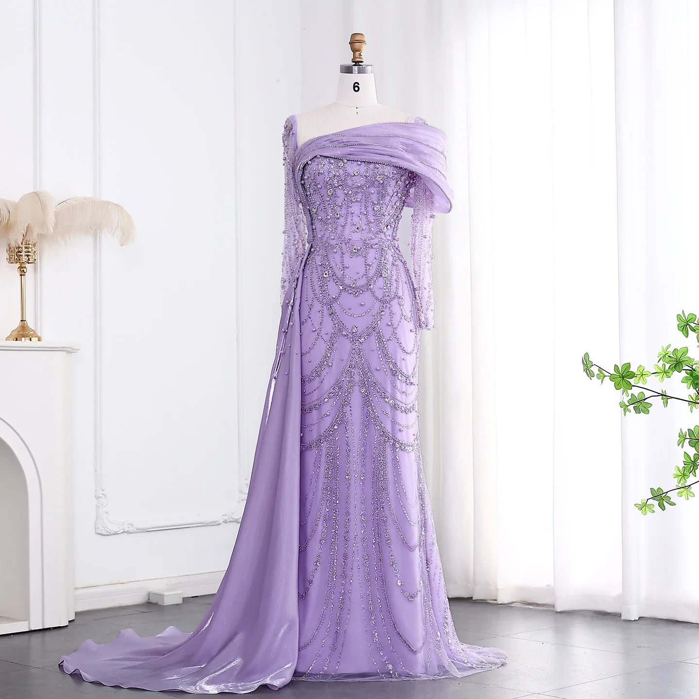Elegant one-shoulder evening dress in luxurious tulle by MC THE BLACK DIAMOND, showcasing a flowing silhouette and sophisticated design.