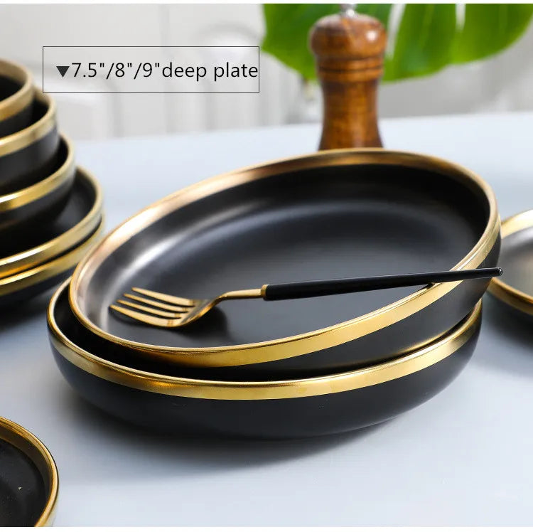 Set of matte gold inlay black porcelain dinnerware from MC THE BLACK DIAMOND, including plates and bowls for elegant kitchen table setting.