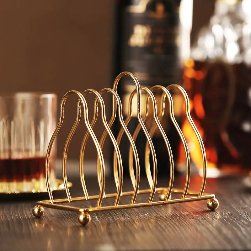 Six golden metal cocktail coasters with classical design from 𝕄𝕔 𝕋𝕙𝕖 𝔹𝕝𝕒𝕔𝕜 𝔻𝕚𝕒𝕞𝕠�