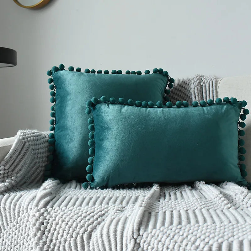 Large velvet throw pillow cover by MC The Black Diamond featuring solid plain design with cozy pom pom accents for sofa or home decor.