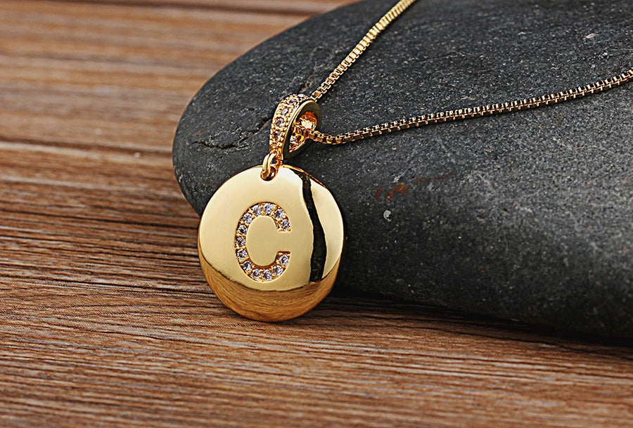 Copper initial letter necklace featuring a "A" charm with cubic zirconia accents, from 𝕄𝕔 𝕋𝕙𝕖 𝔹𝕝𝕒𝕔𝕜 𝔻𝕚𝕒