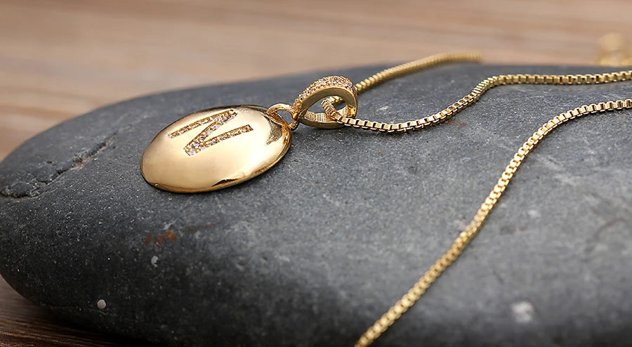 Nidin women's initial letter necklace with 26 A-Z copper charm pendant featuring cubic zirconia, jewelry by 𝕄𝕔 𝕋𝕙𝕖 𝔹𝕝𝕒𝕔𝕜 𝔻�