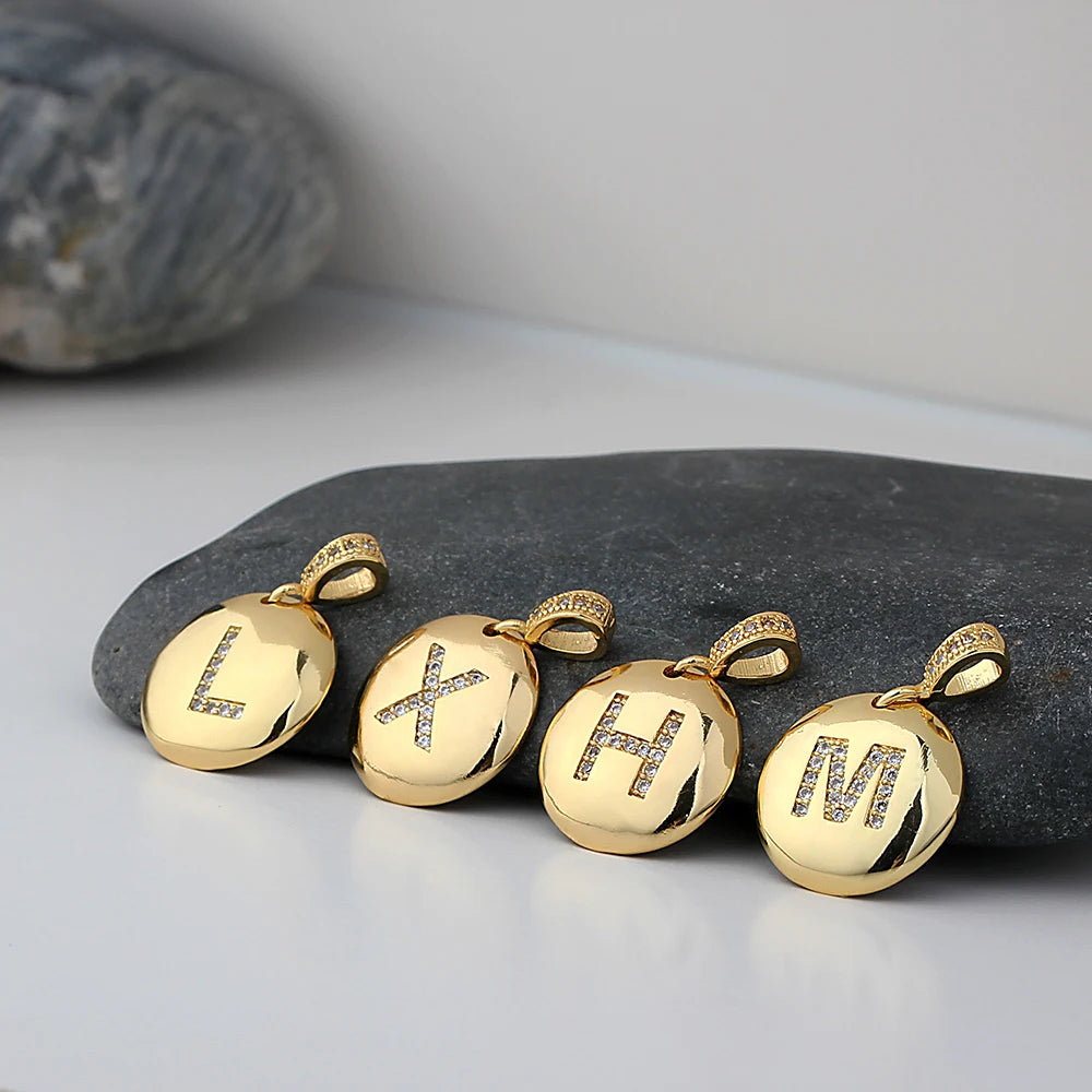 Nidin initial letter necklace featuring a copper pendant with CZ stones, personalized jewelry from 𝕄𝕔 𝕋𝕙𝕖 𝔹𝕝𝕒𝕔𝕜 𝔻𝕚𝕒�