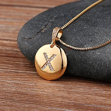 Nidin initial letter necklace featuring a copper pendant with CZ stones, showcasing a personalized jewelry piece from 𝕄𝕔 𝕋𝕙𝕖 𝔹𝕝𝕒𝕔𝕜 𝔻𝕚�