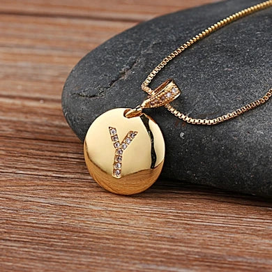 Initial letter necklace by MC The Black Diamonds featuring a copper charm with CZ stone, personalized jewelry for women and girls.