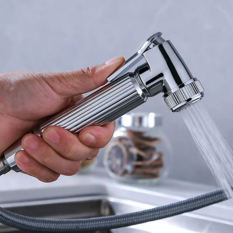 Black deck-mounted kitchen sink faucet by MC THE BLACK DIAMOND with flexible pull-out spout, hot and cold water controls.