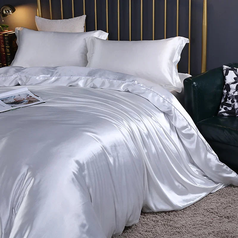 Luxury silk bedding set with duvet cover, fitted sheet, flat sheet, and pillowcases in solid color from MC The Black Diamonds.