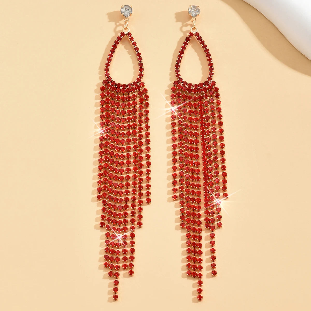 Pair of women's jewelry rhinestone tassel earrings by MC The Black Diamonds with sparkling rhinestones and dangling tassels.