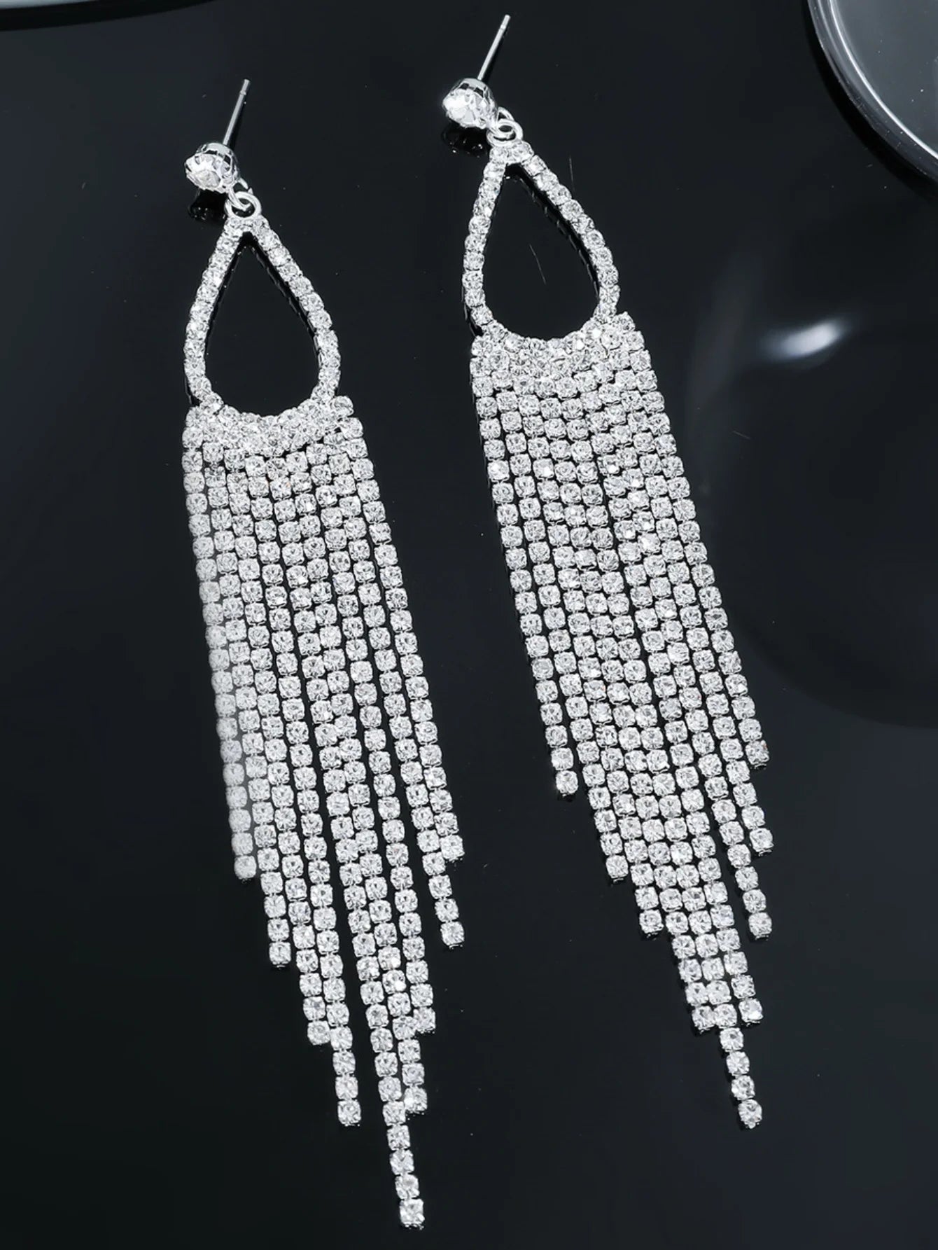Two pairs of women's jewelry rhinestone tassel earrings from MC The Black Diamonds, featuring sparkling rhinestones and elegant tassel design.