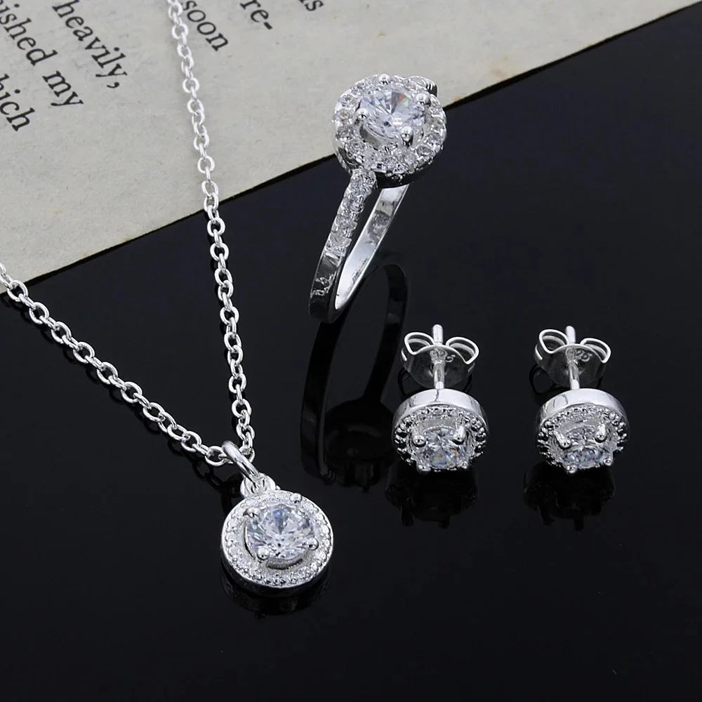 Zircon crystal silver jewelry set including necklace, ring, and earrings featuring sparkling zircon stones by MC The Black Diamonds.