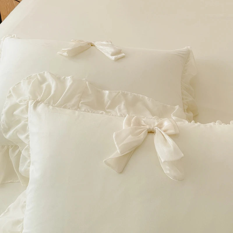 3-piece white bedding set with ruffled duvet cover from MC The Black Diamonds, featuring soft bedsheets and elegant design.