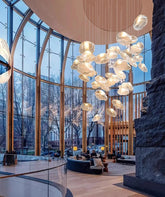 Modern crystal chandelier by MC THE BLACK DIAMOND featuring elegant hanging crystals and a sleek lighting fixture for home decoration.