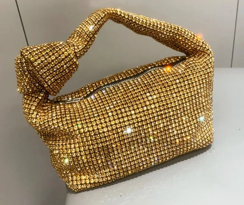 Silver crystal handle evening bag with rhinestone knot detail, luxury designer tote by MC THE BLACK DIAMOND, perfect for women.