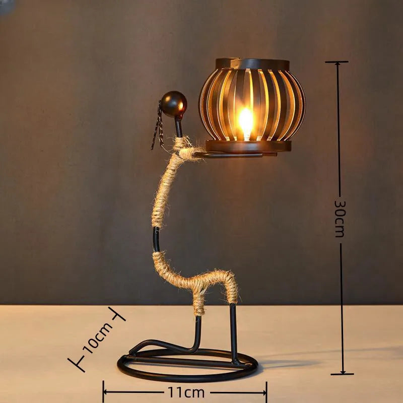 Nordic metal candlestick with abstract character sculpture by 𝕄𝕔 𝕋𝕙𝕖 𝔹𝕝𝕒𝕔𝕜 𝔻𝕚𝕒𝕞𝕠�